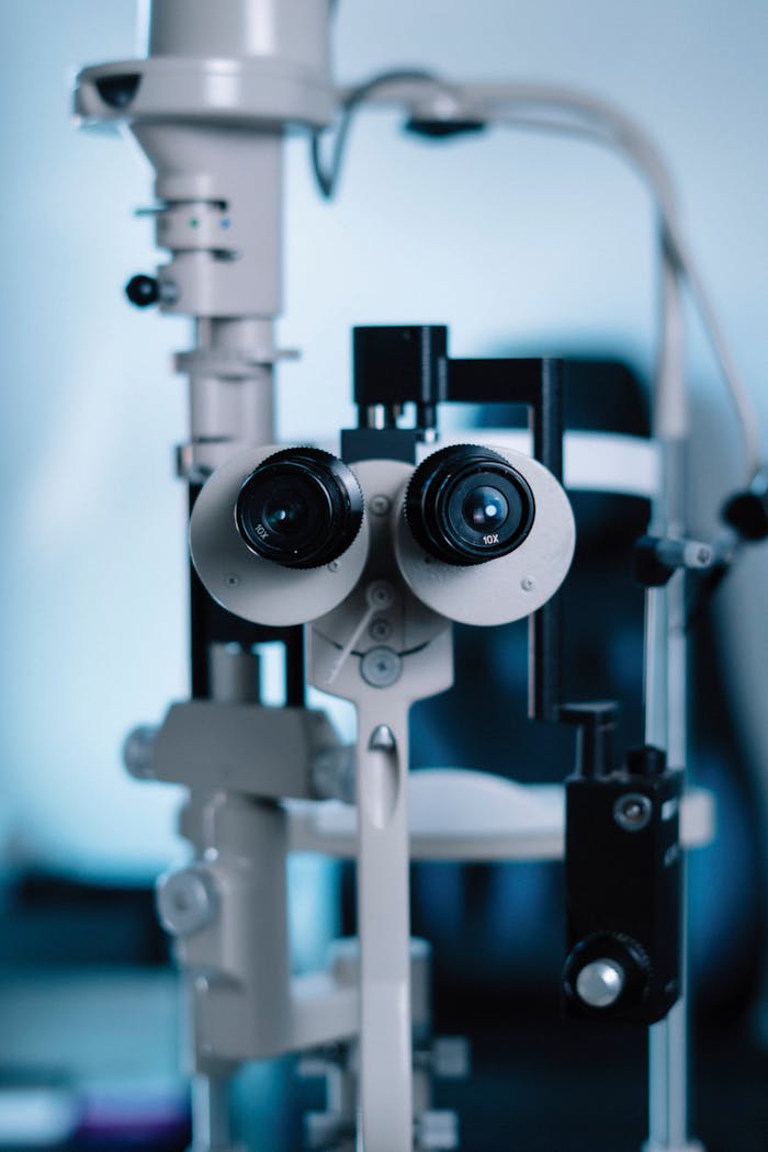 Close-up of professional optometry equipment used for eye examinations, showcasing technical details.